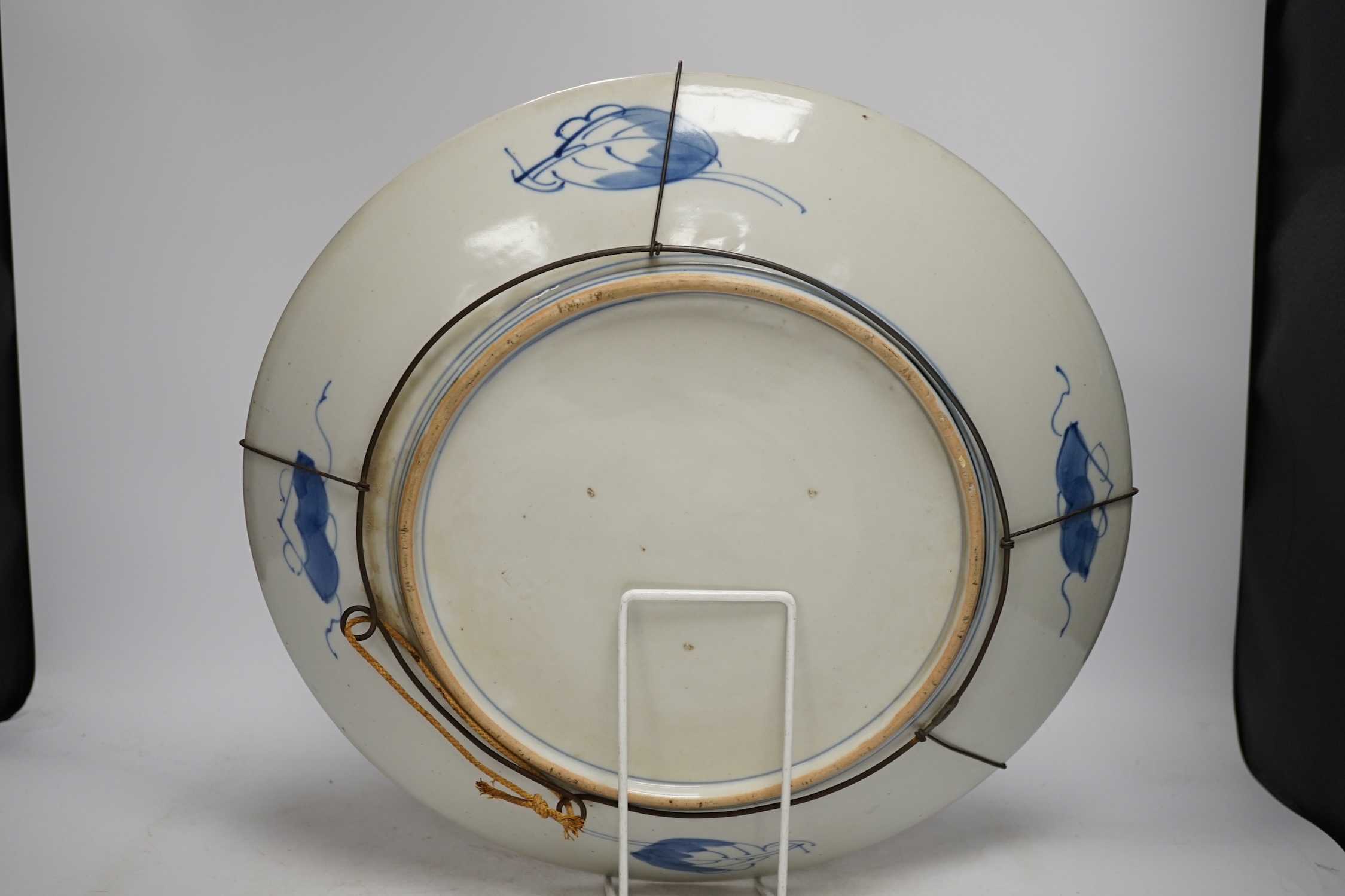 A pair of Japanese cloisonné enamel ‘dragon’ vases and a Japanese Imari dish, 39.5cm diameter (3). Condition - fair to good